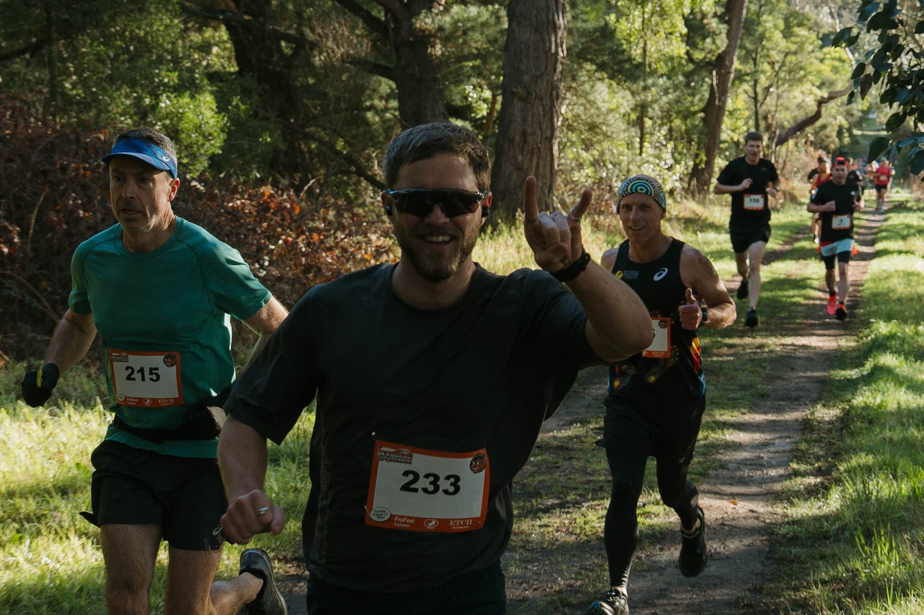 Runners on a shaded Devilbend trail